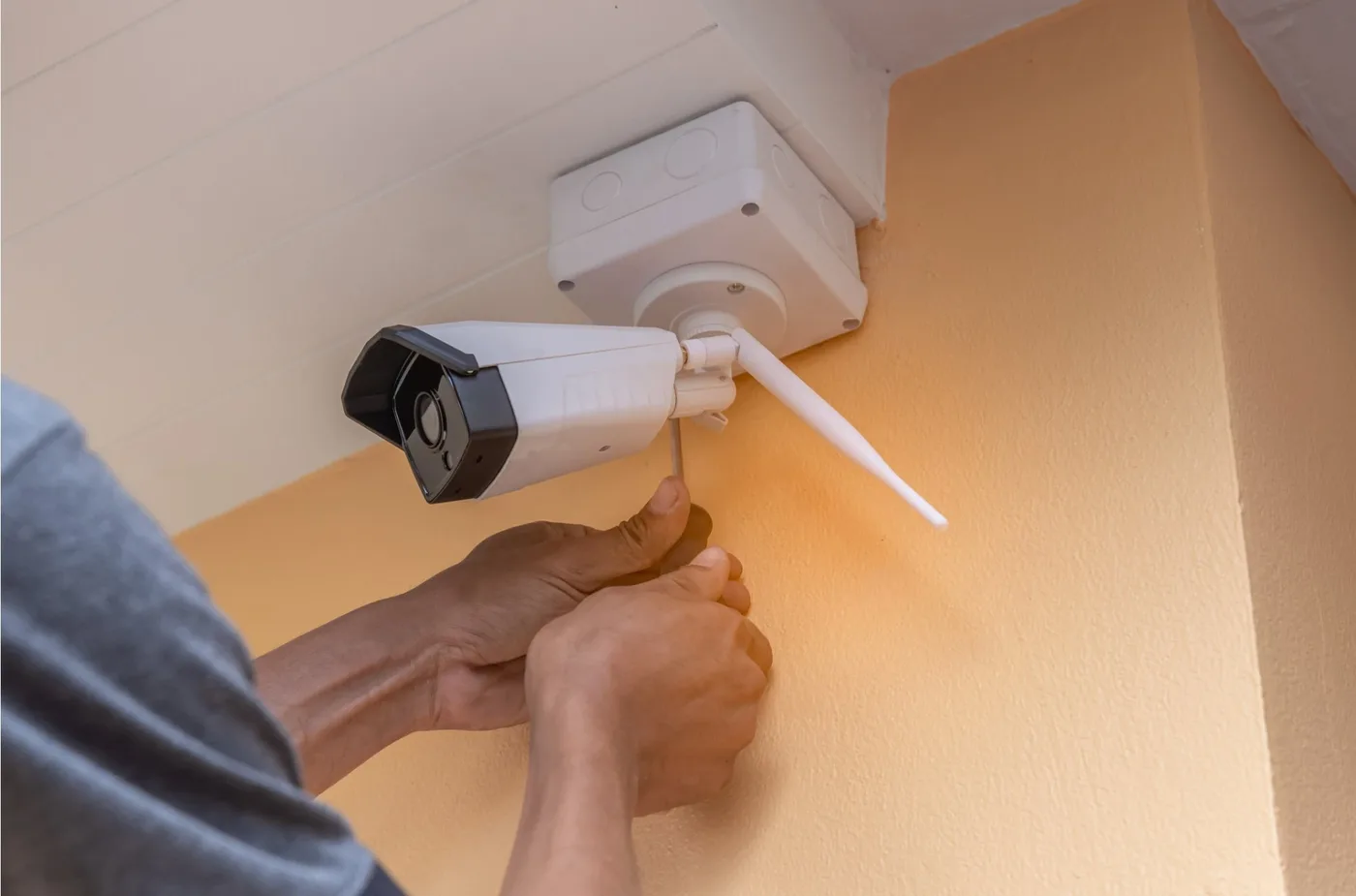 True Guard technician installing a security camera in Mississauga